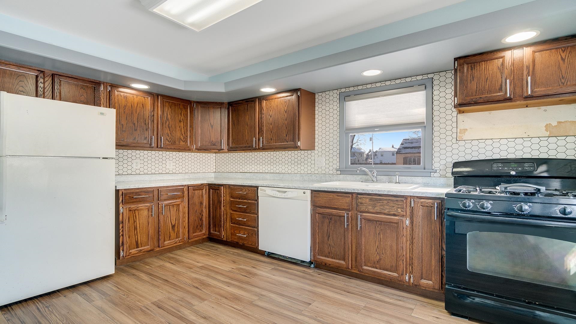 567 South 2nd Street Rochelle, IL 61068 - Photo 8 of 20 a kitchen with stainless steel appliances granite countertop a stove sink and cabinets