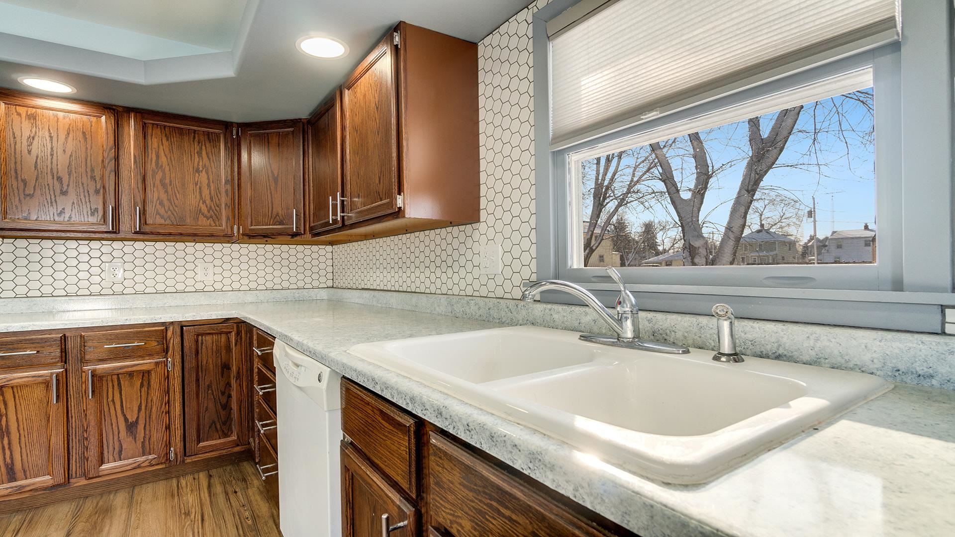 567 South 2nd Street Rochelle, IL 61068 - Photo 9 of 20 a kitchen with a sink a window and cabinets
