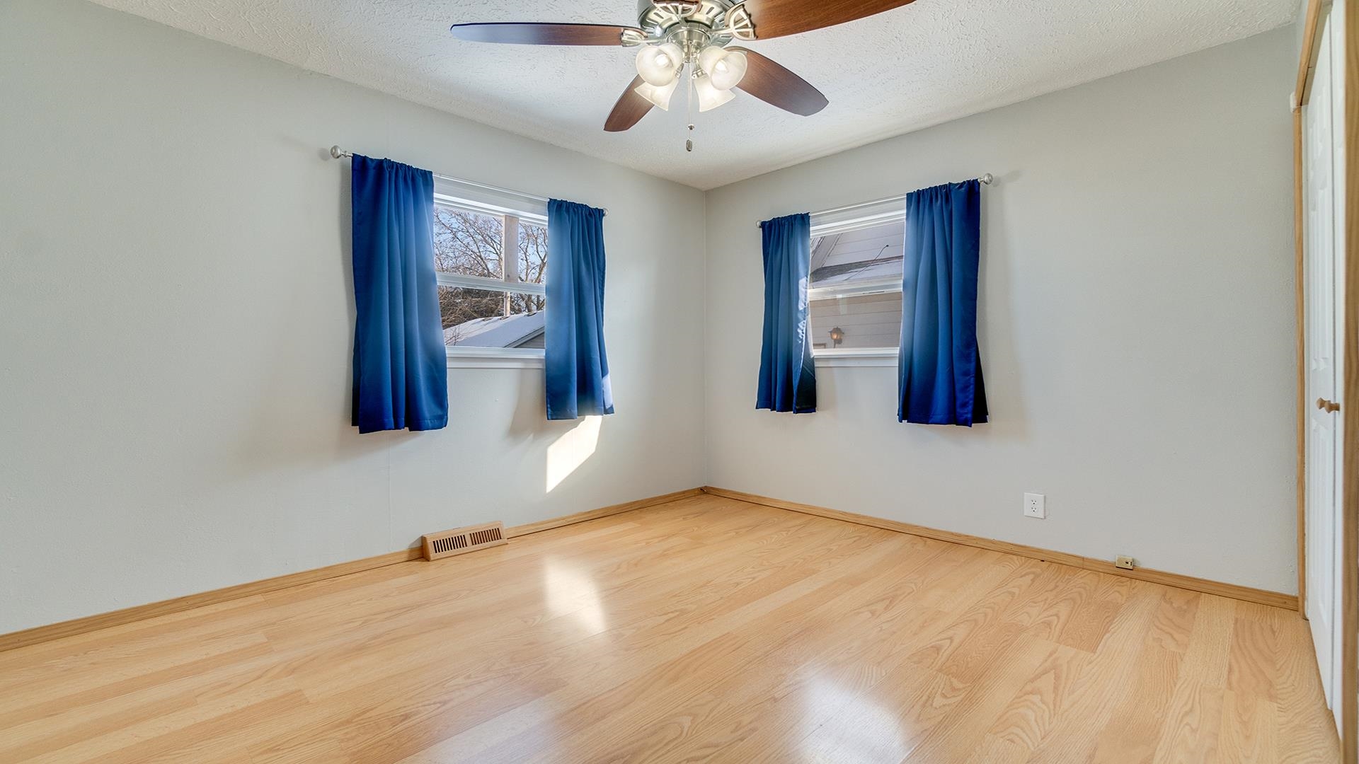 567 South 2nd Street Rochelle, IL 61068 - Photo 10 of 20 a view of an empty room with chandelier fan and wooden floor