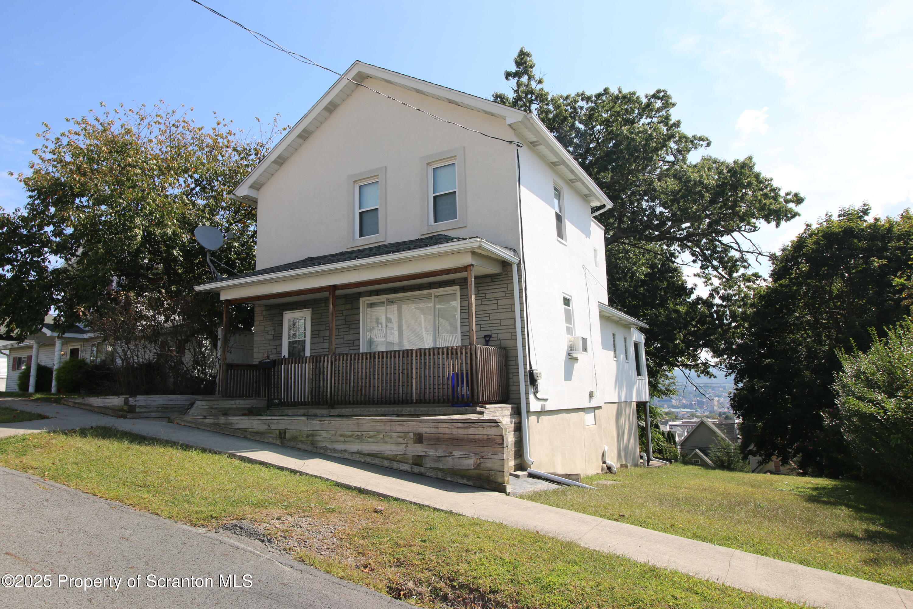 352 North Fillmore Avenue Scranton, PA 18504 - Photo 2 of 16 a front view of a house with a yard