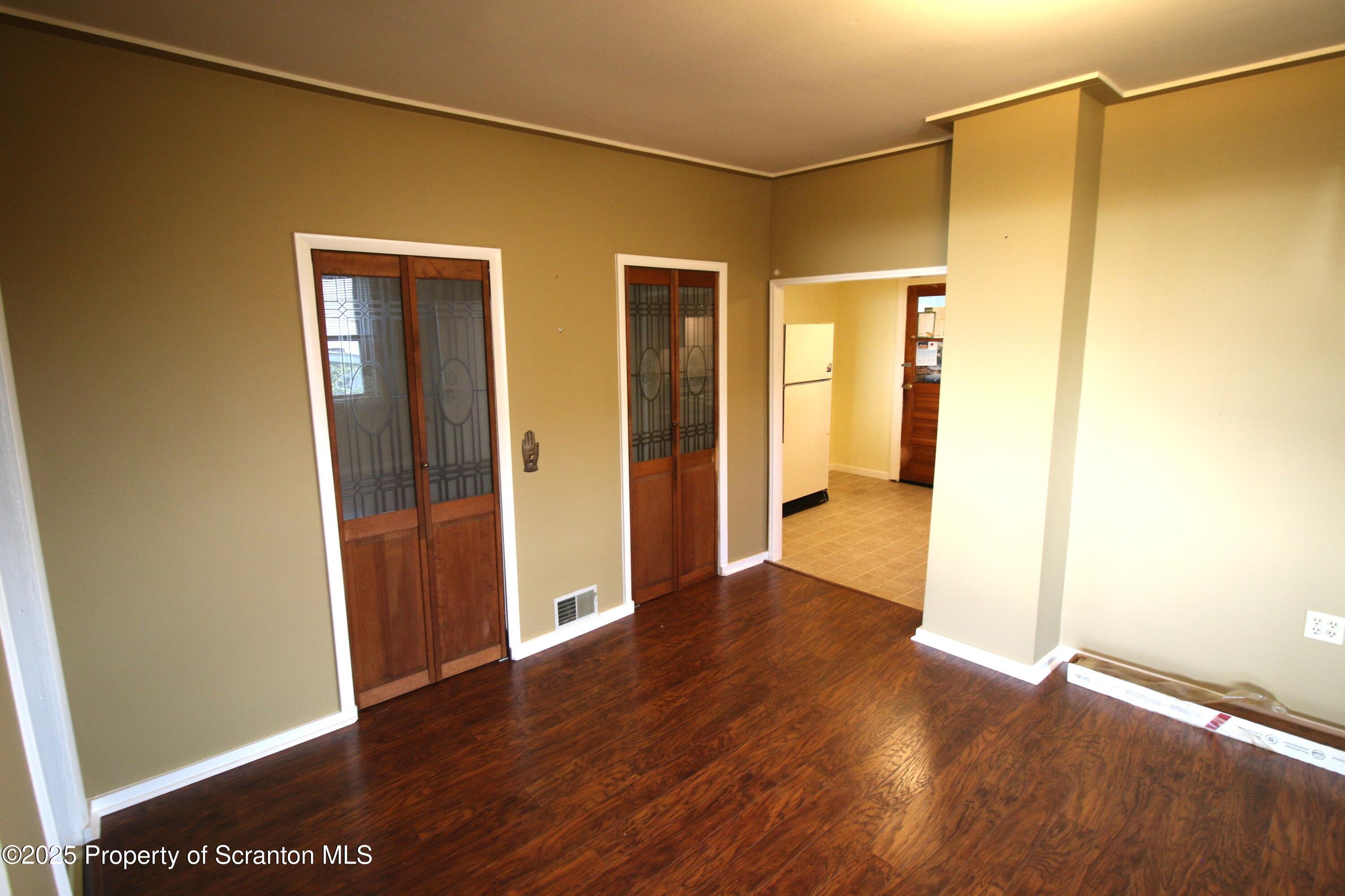 352 North Fillmore Avenue Scranton, PA 18504 - Photo 7 of 16 a view of an empty room with wooden floor