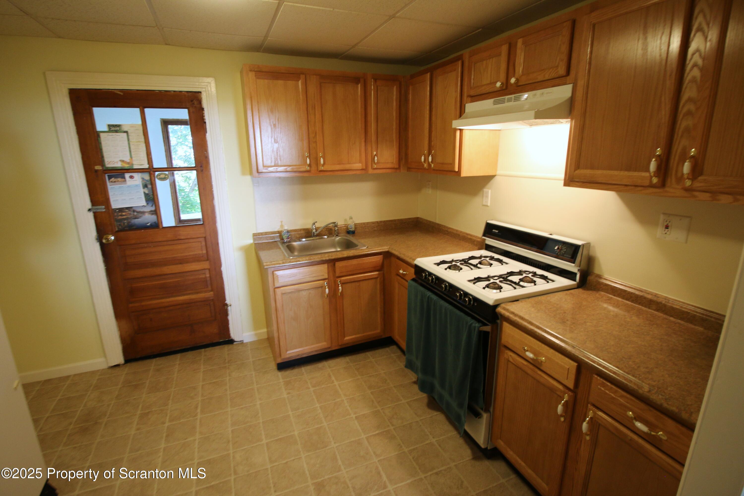 352 North Fillmore Avenue Scranton, PA 18504 - Photo 8 of 16 a kitchen with a stove and a refrigerator