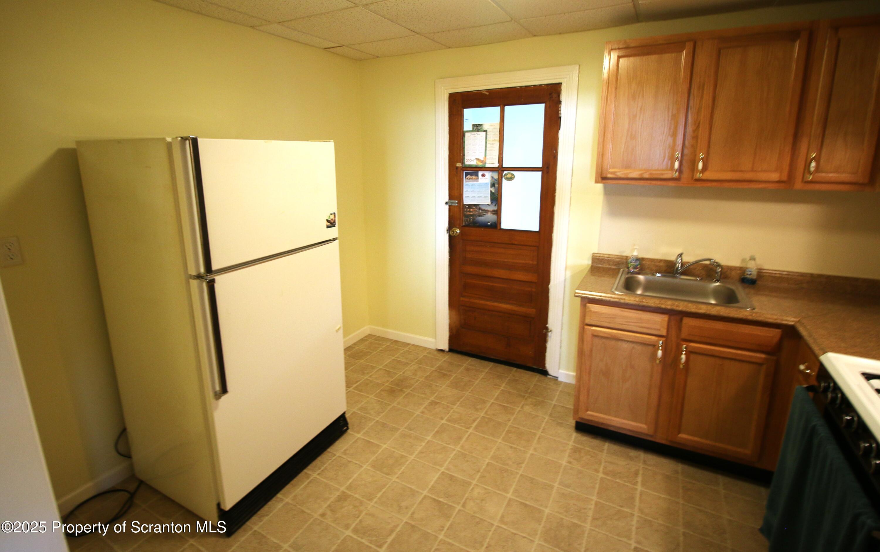 352 North Fillmore Avenue Scranton, PA 18504 - Photo 9 of 16 a kitchen with refrigerator and window