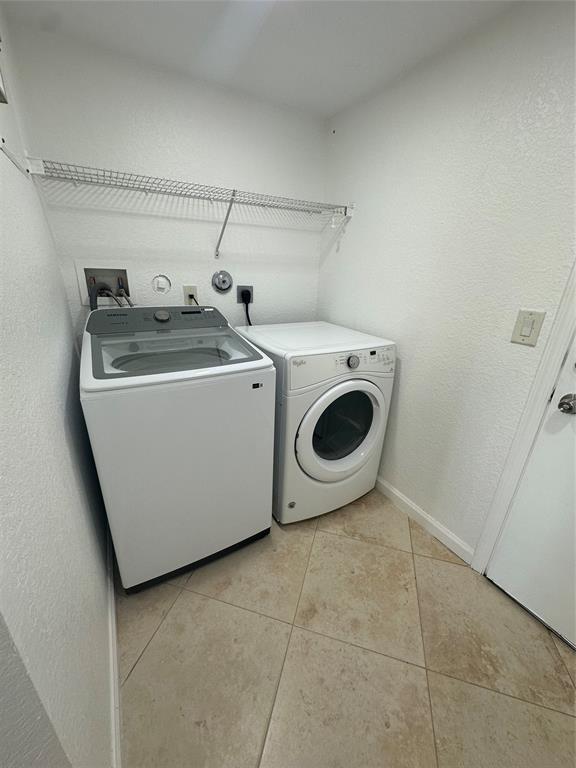 13376 Southwest 47th Street Miramar, FL 33027 - Photo 12 of 38 a utility room with dryer and washer