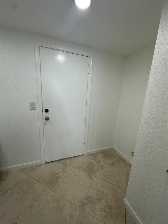 13376 Southwest 47th Street Miramar, FL 33027 - Photo 13 of 38 an empty room with a hallway
