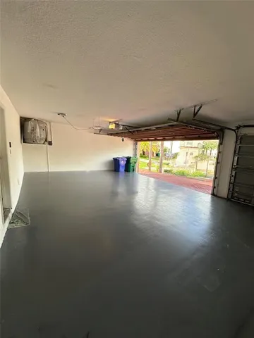 a view of an ocean and a floor to ceiling window