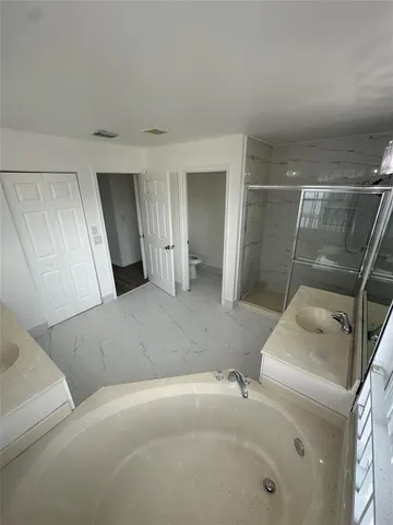 a living room with a couch and a dresser