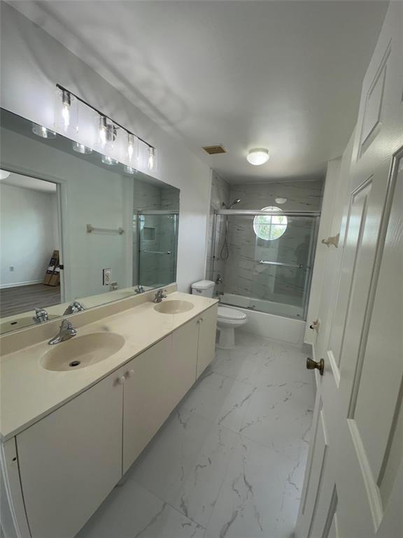 13376 Southwest 47th Street Miramar, FL 33027 - Photo 28 of 38 a bathroom with a tub sink shower and mirror