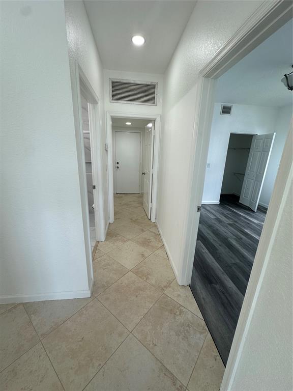 13376 Southwest 47th Street Miramar, FL 33027 - Photo 9 of 38 a view of a hallway and wooden floor