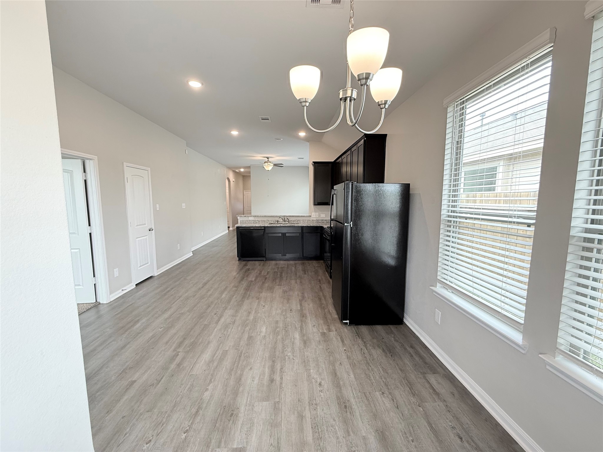 14501 Sugar Pines Drive Conroe, TX 77302 - Photo 18 of 46 a view of kitchen with refrigerator and window
