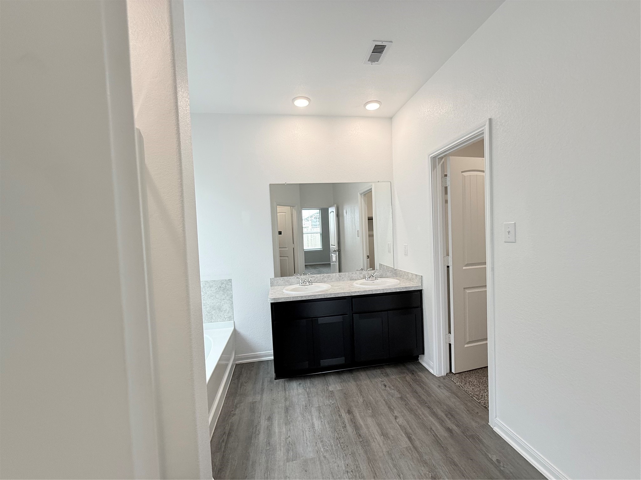 14501 Sugar Pines Drive Conroe, TX 77302 - Photo 32 of 46 a view of room with wooden floor and window