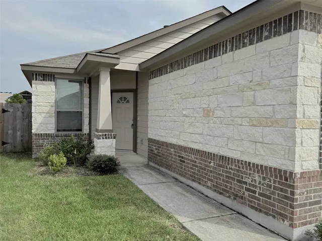 a view of house with backyard