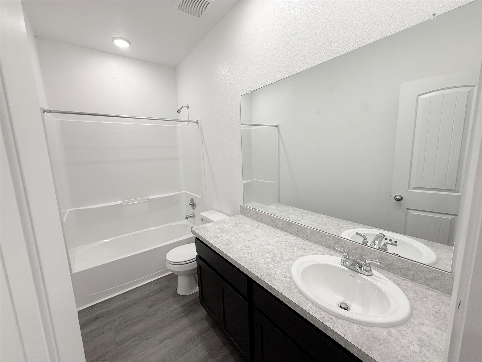 14501 Sugar Pines Drive Conroe, TX 77302 - Photo 41 of 46 a bathroom with a granite countertop sink toilet and shower