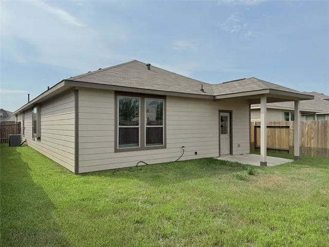 a house view with backyard space and garden