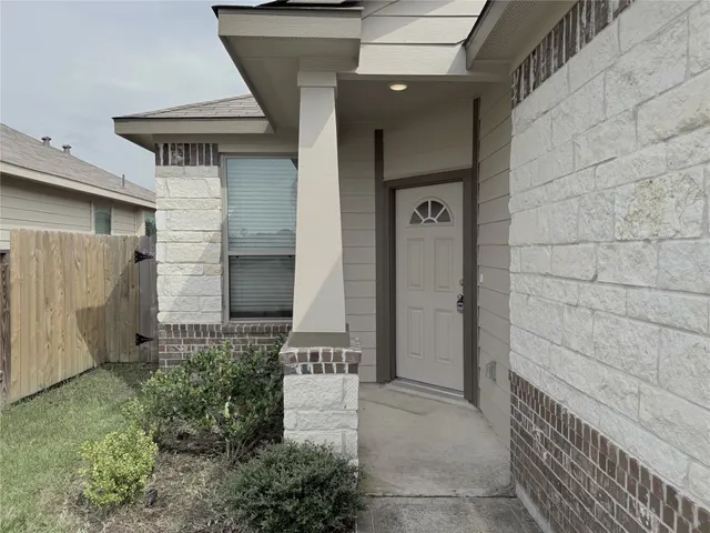 a view of a wooden door of the house