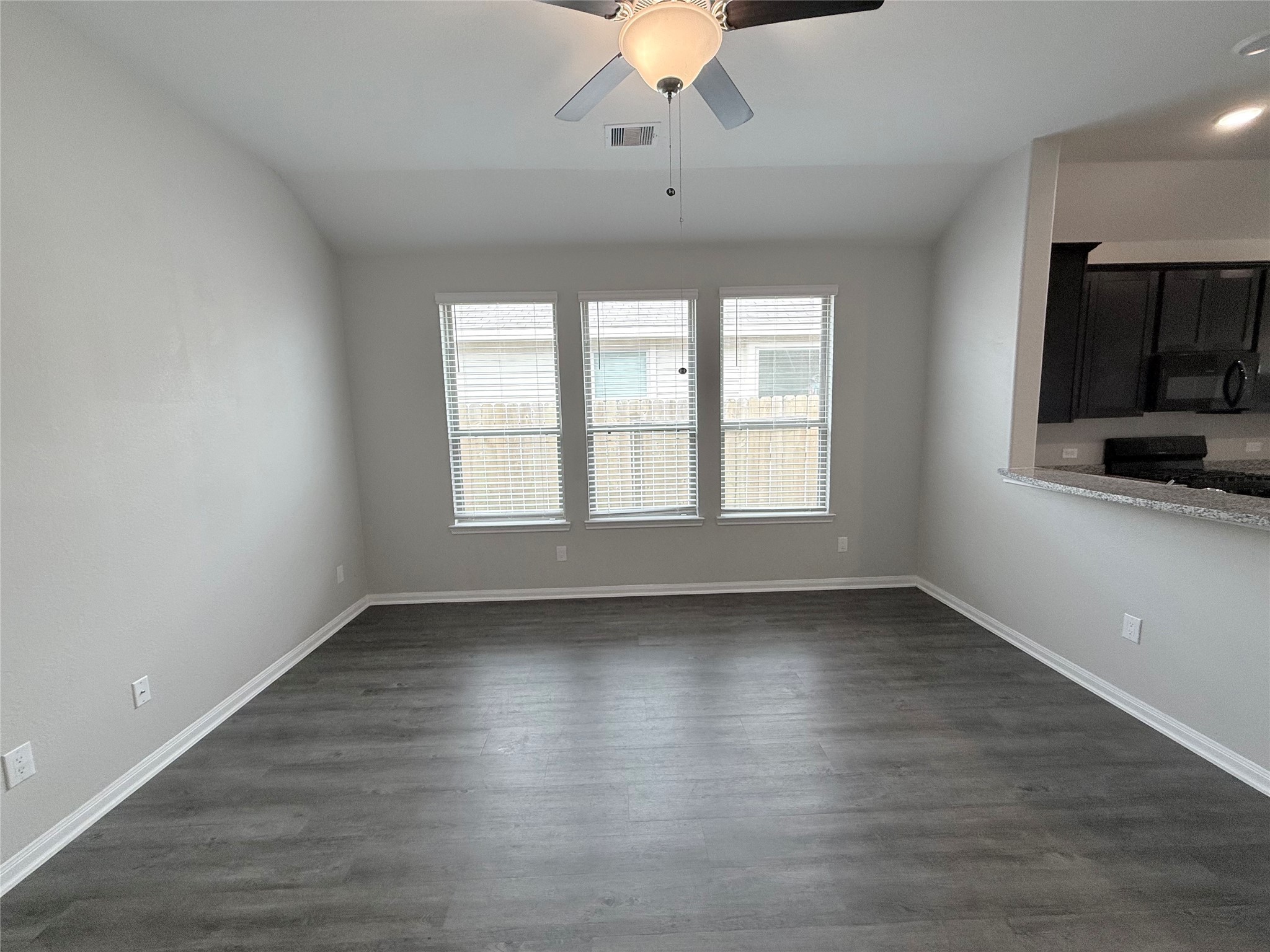 14501 Sugar Pines Drive Conroe, TX 77302 - Photo 7 of 46 wooden floor in an empty room with a window