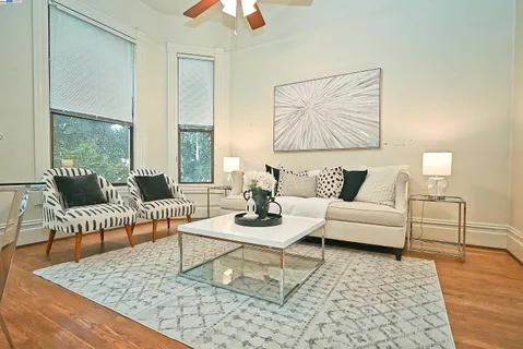 a living room with furniture and a rug