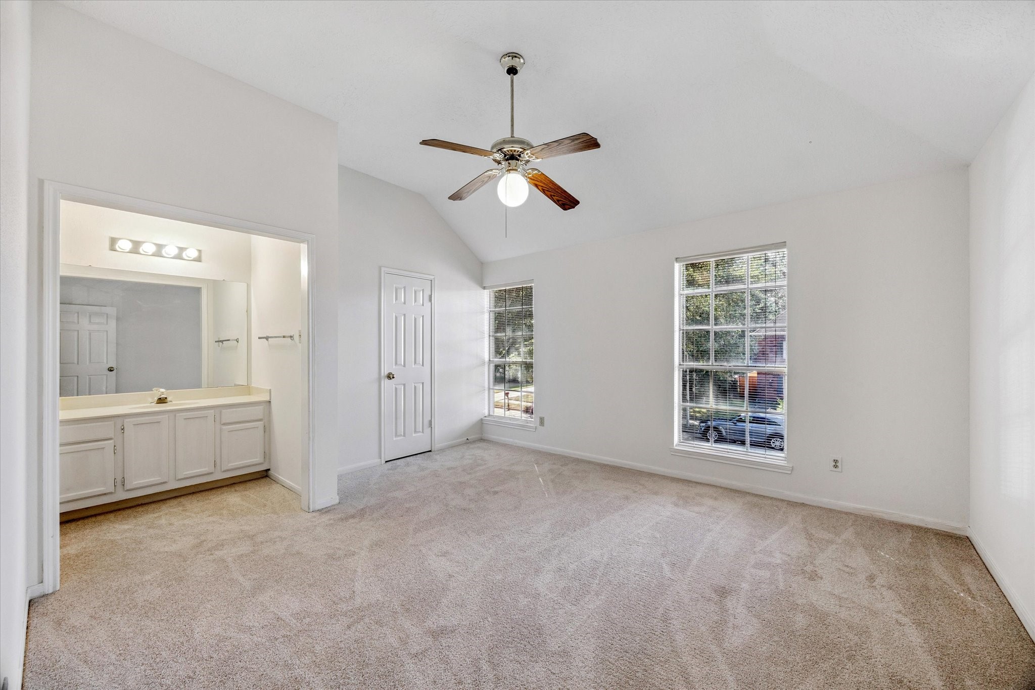 6523 Inverness Way Pasadena, TX 77505 - Photo 12 of 15 a view of an empty room with a window and a kitchen