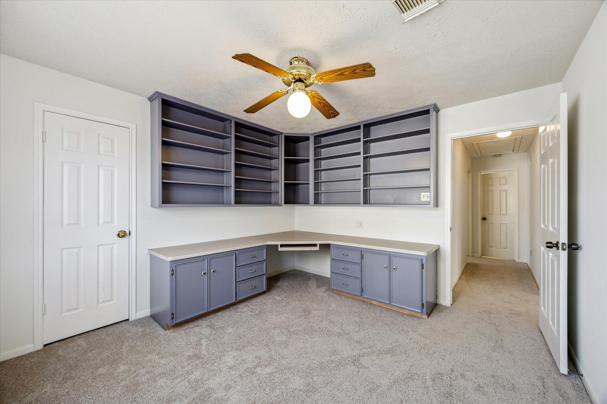 6523 Inverness Way Pasadena, TX 77505 - Photo 13 of 15 an empty room with a ceiling fan and window
