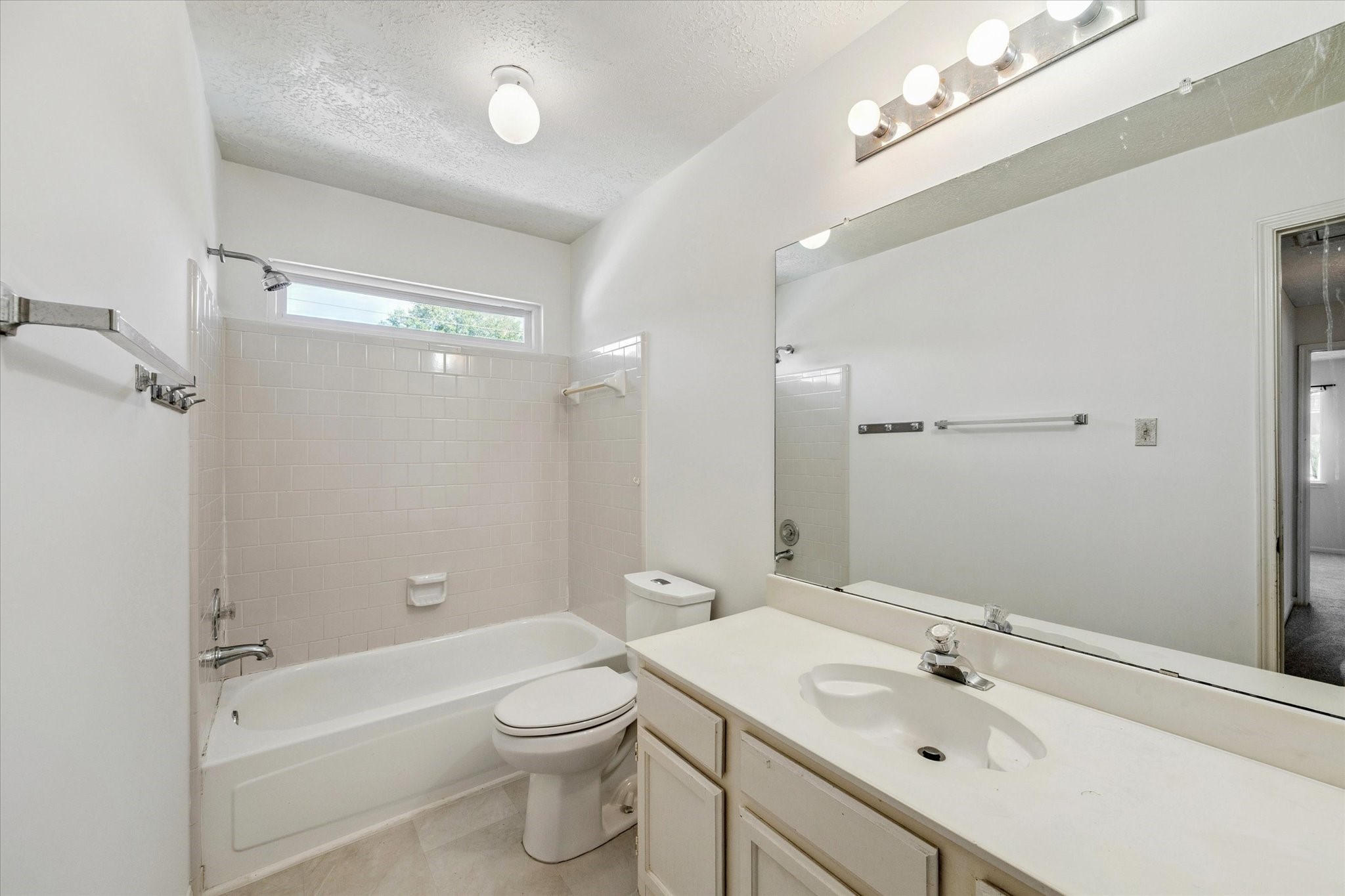 6523 Inverness Way Pasadena, TX 77505 - Photo 14 of 15 a bathroom with a sink a toilet and shower