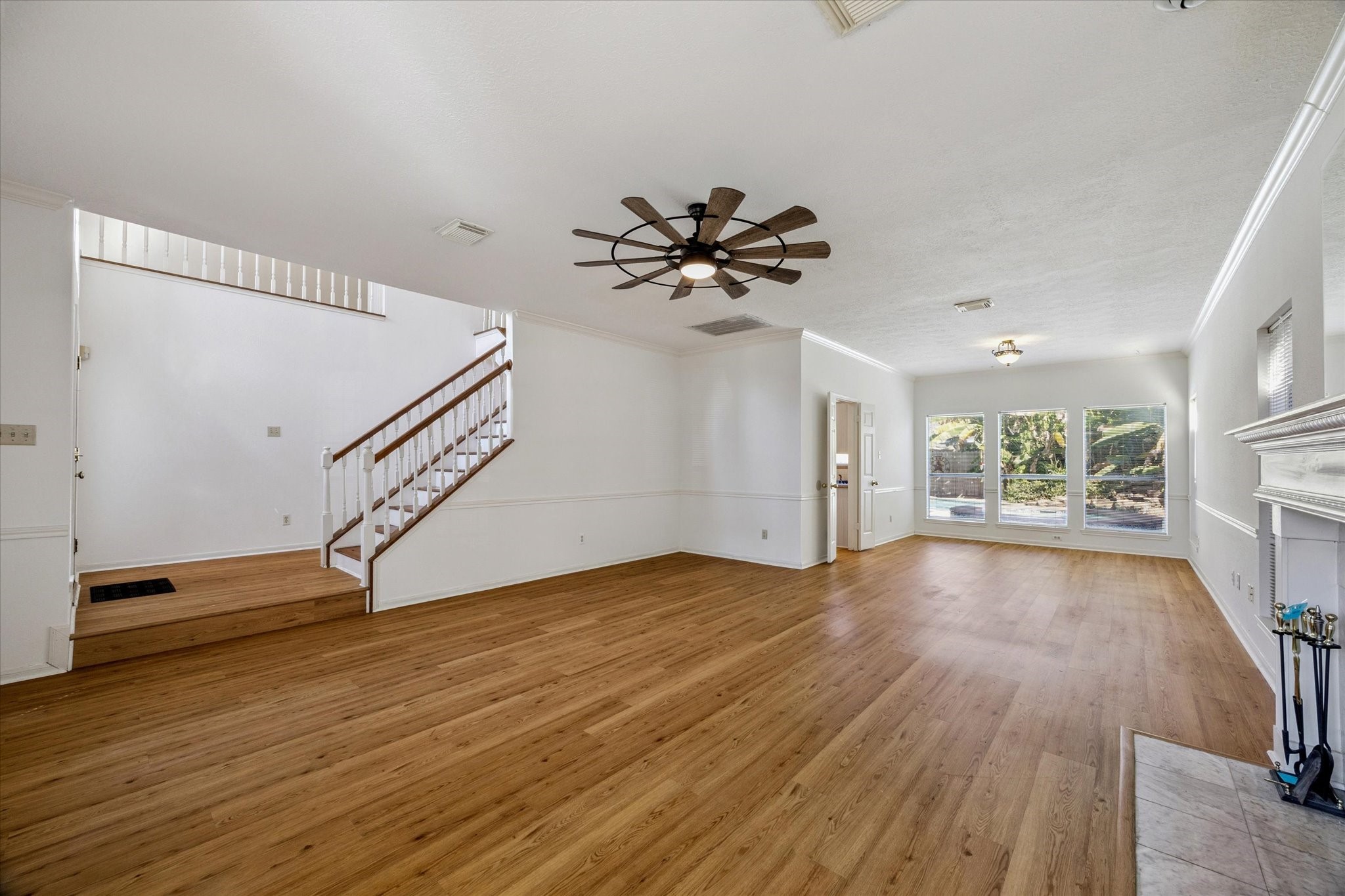 6523 Inverness Way Pasadena, TX 77505 - Photo 4 of 15 an empty room with wooden floor and windows