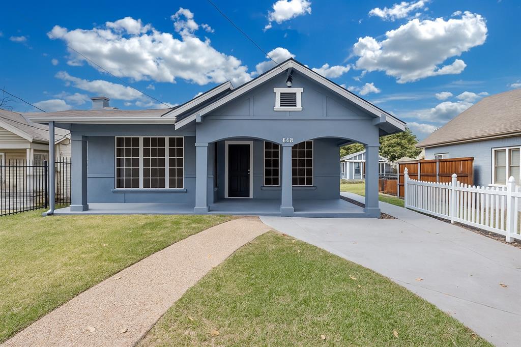 644 North Tyler Street Dallas, TX 75208 - Photo 1 of 33 a front view of a house with a garden