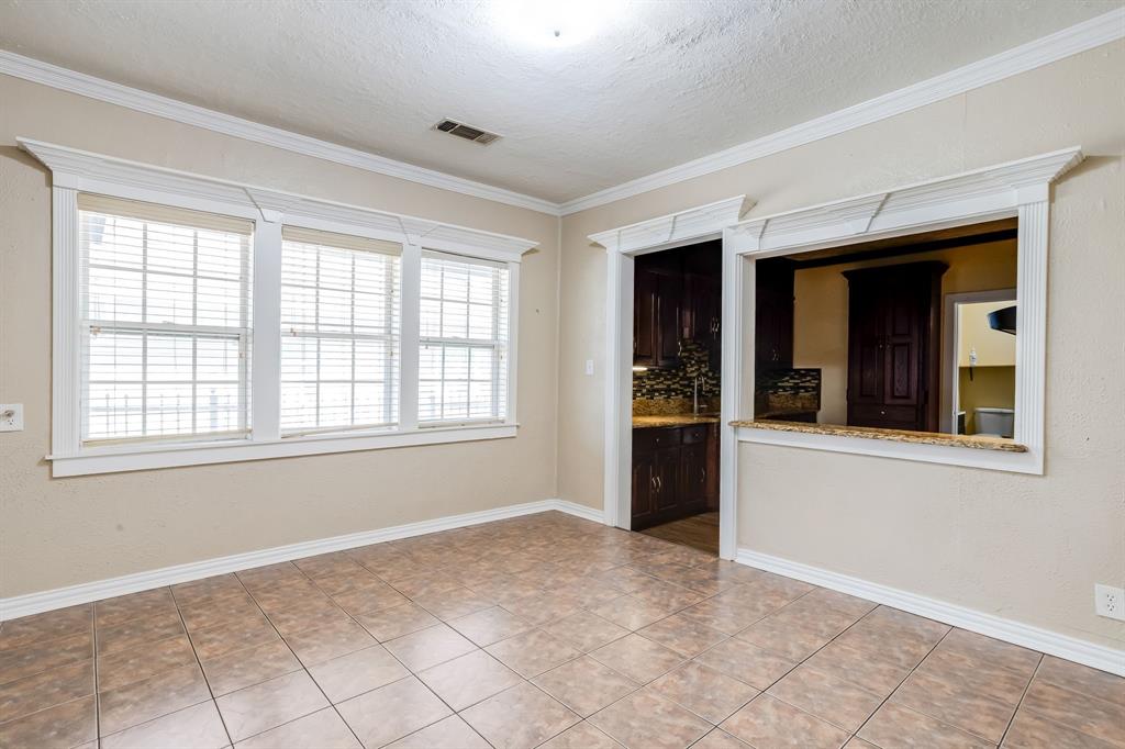 644 North Tyler Street Dallas, TX 75208 - Photo 11 of 33 a view of an empty room with window and chandelier