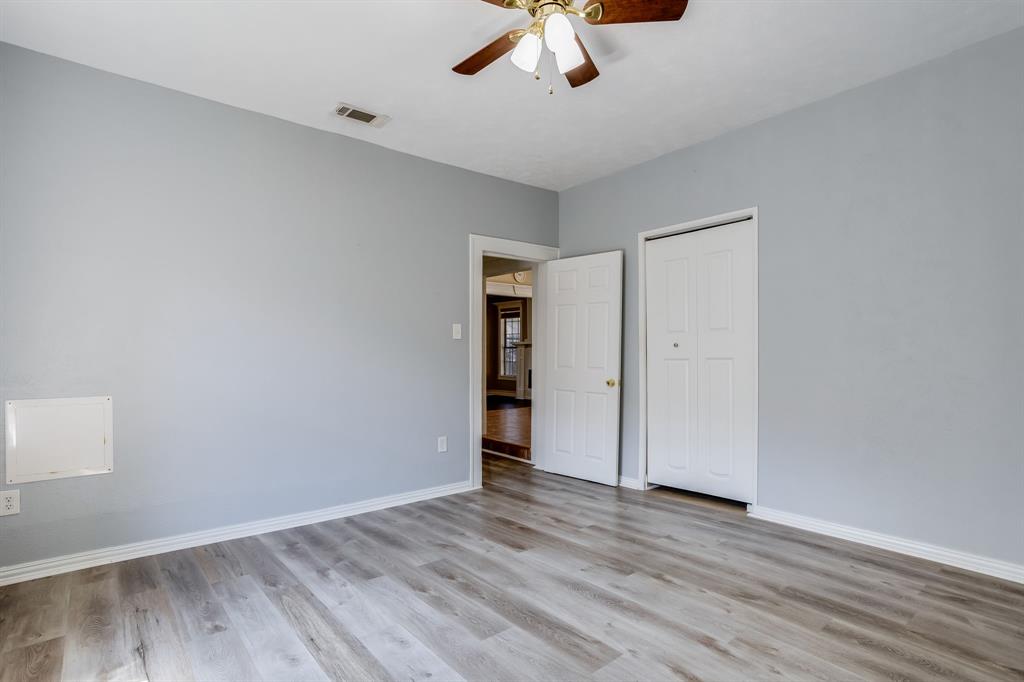 644 North Tyler Street Dallas, TX 75208 - Photo 16 of 33 a view of an empty room with wooden floor
