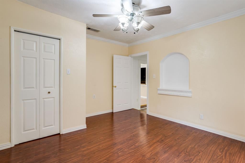 644 North Tyler Street Dallas, TX 75208 - Photo 18 of 33 an empty room with wooden floor and windows