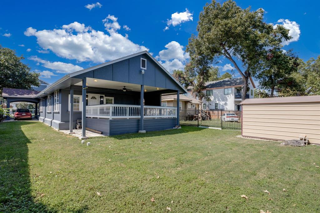 644 North Tyler Street Dallas, TX 75208 - Photo 26 of 33 a view of a house with a backyard porch and sitting area
