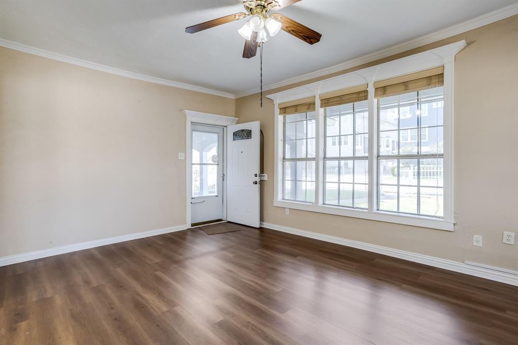 644 North Tyler Street Dallas, TX 75208 - Photo 5 of 33 wooden floor in an empty room with a window