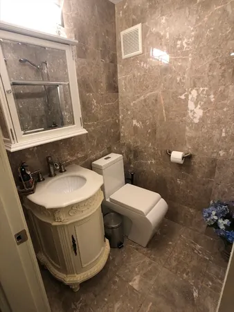 a bedroom with bed and window