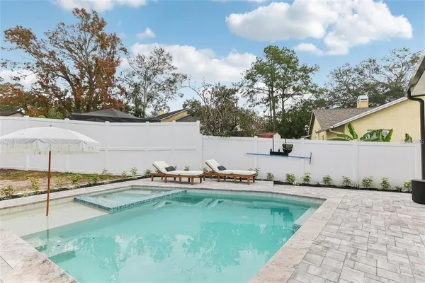 a view of a swimming pool with a patio
