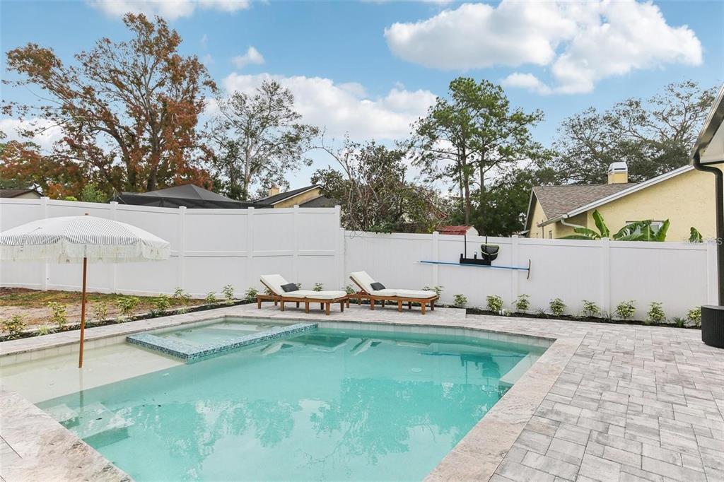3775 Springhill Circle Palm Harbor, FL 34684 - Photo 2 of 5 a view of a swimming pool with a patio