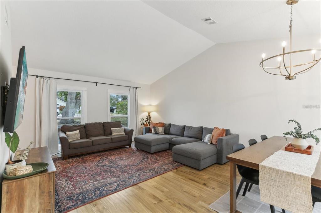 3775 Springhill Circle Palm Harbor, FL 34684 - Photo 3 of 5 a living room with furniture and a flat screen tv