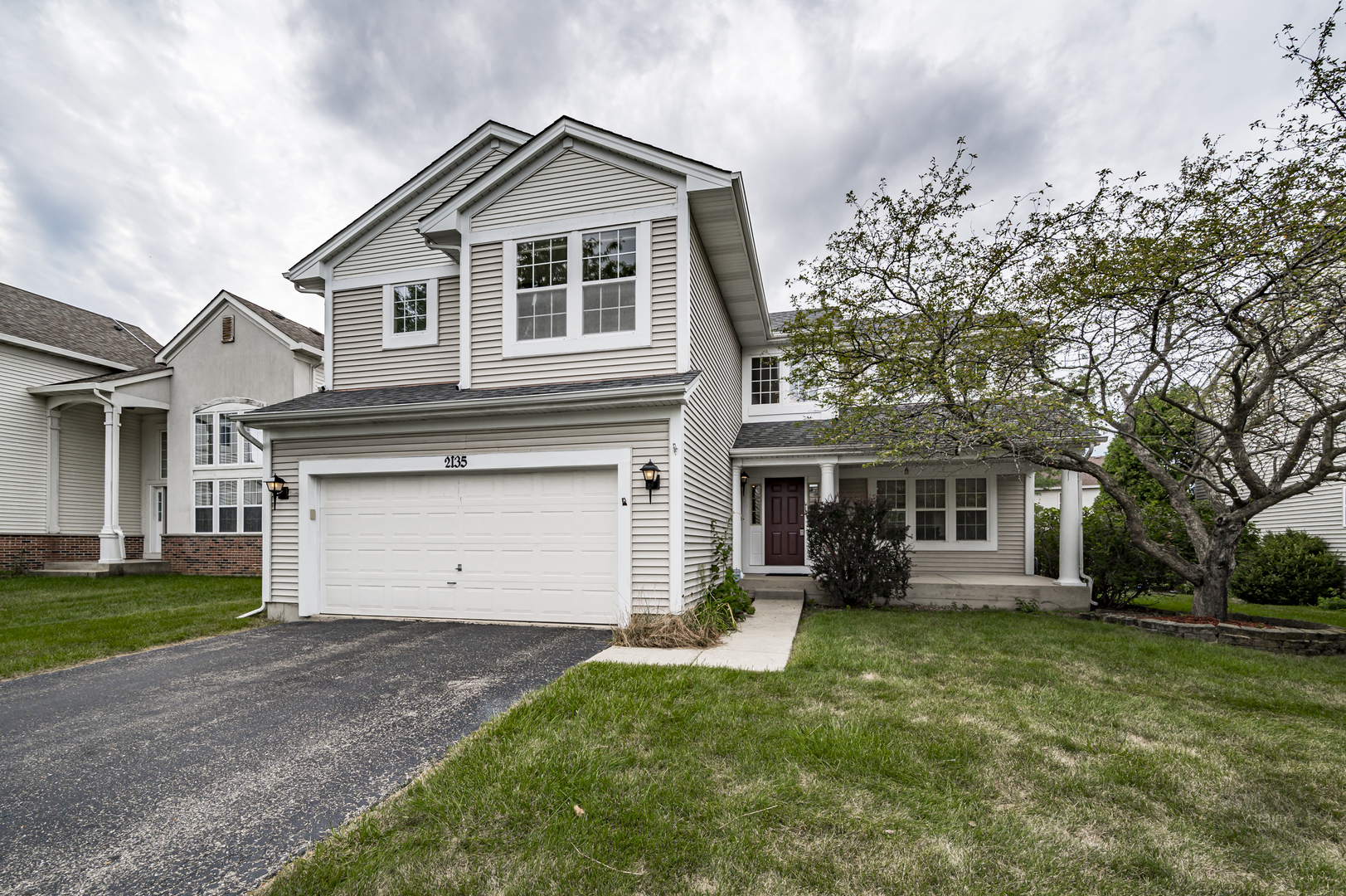 a view of a yard in front view of a house
