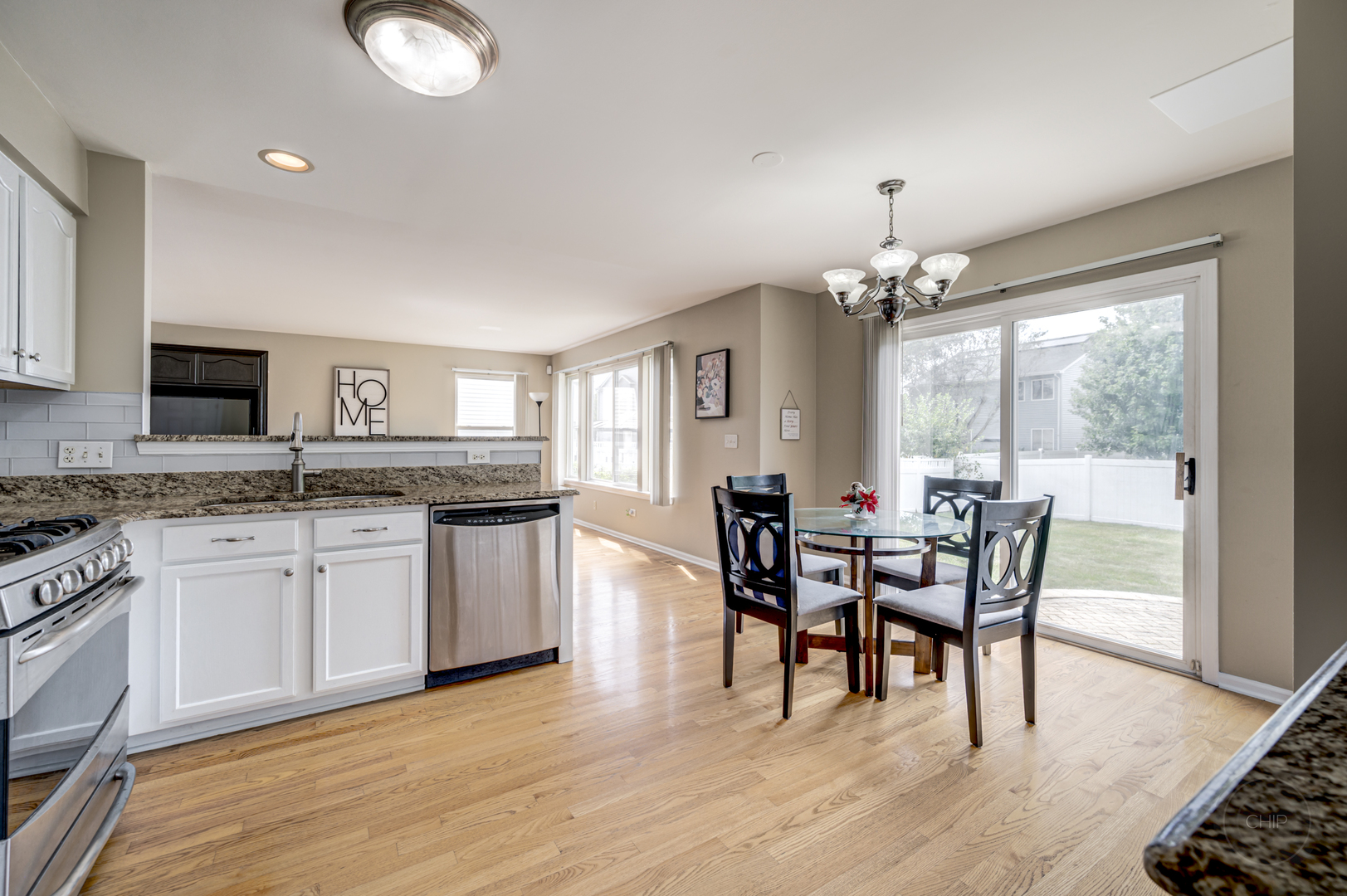 2135 Skylane Drive Naperville, IL 60564 - Photo 12 of 44 a view of a dining room with furniture and chandelier