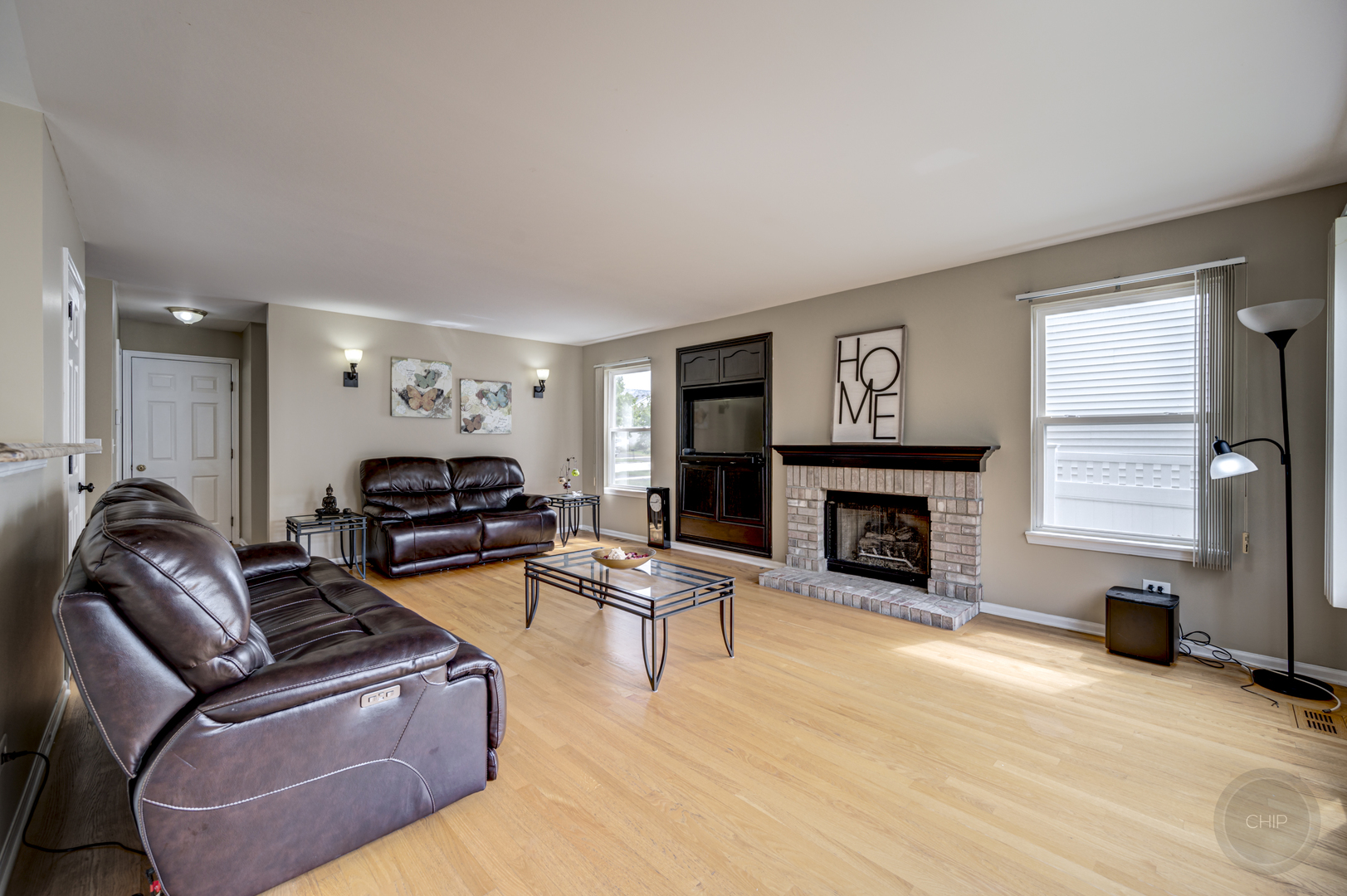 2135 Skylane Drive Naperville, IL 60564 - Photo 16 of 44 a living room with furniture and a fireplace