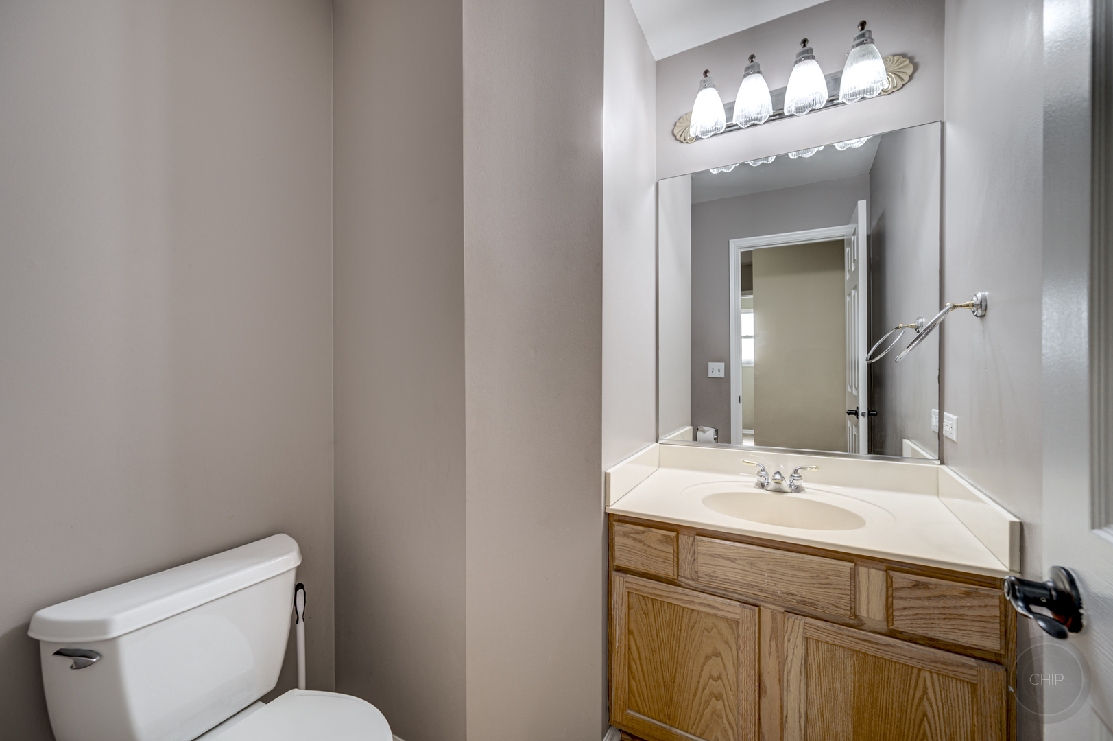 2135 Skylane Drive Naperville, IL 60564 - Photo 19 of 44 a bathroom with a sink and a mirror