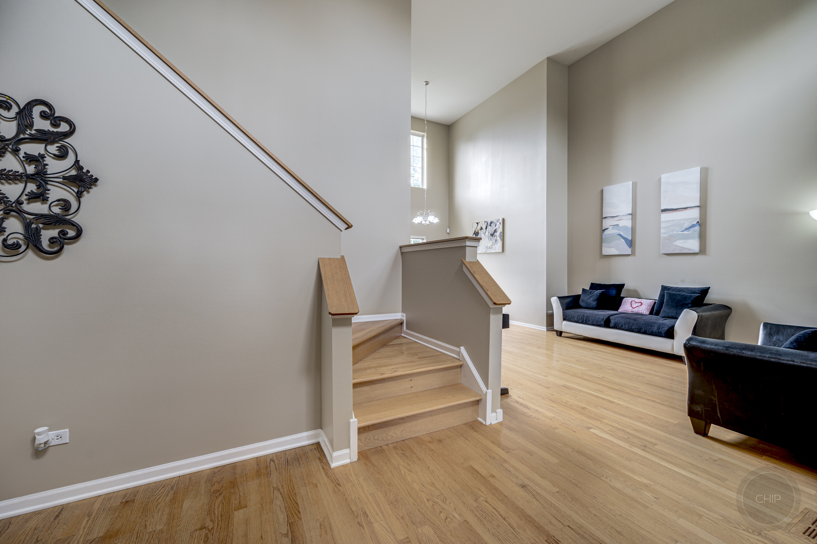 2135 Skylane Drive Naperville, IL 60564 - Photo 2 of 44 a view of a livingroom with wooden floor and furniture