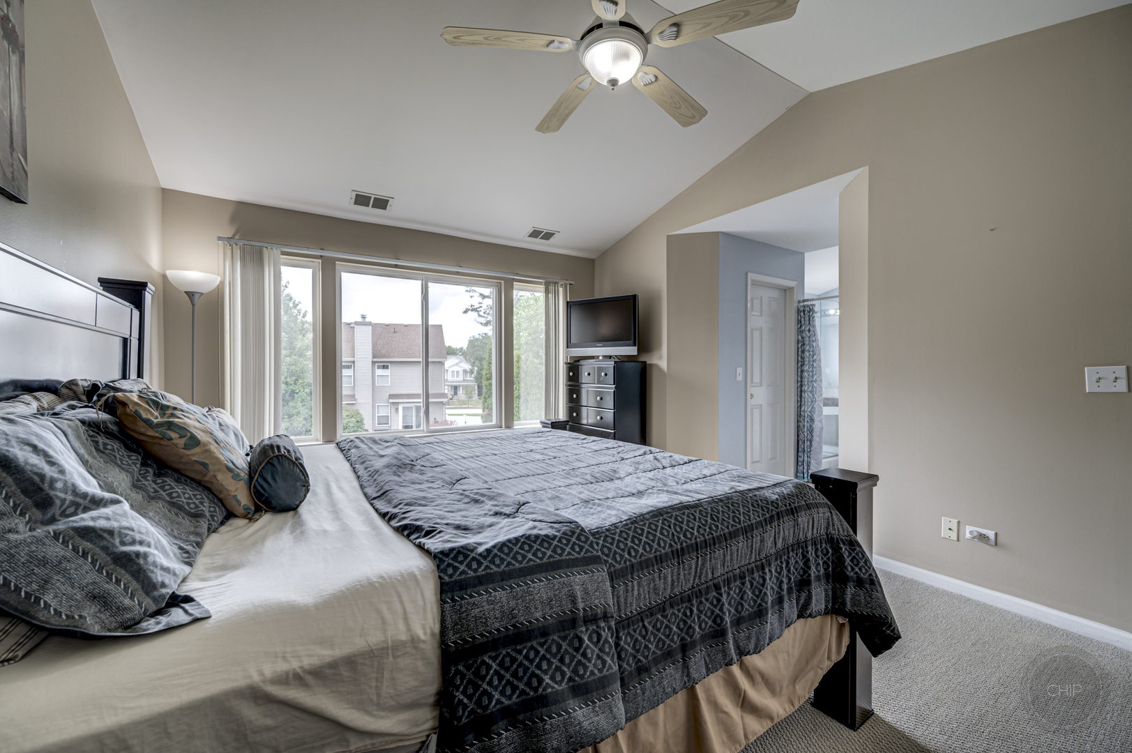 2135 Skylane Drive Naperville, IL 60564 - Photo 21 of 44 a bedroom with a bed and window