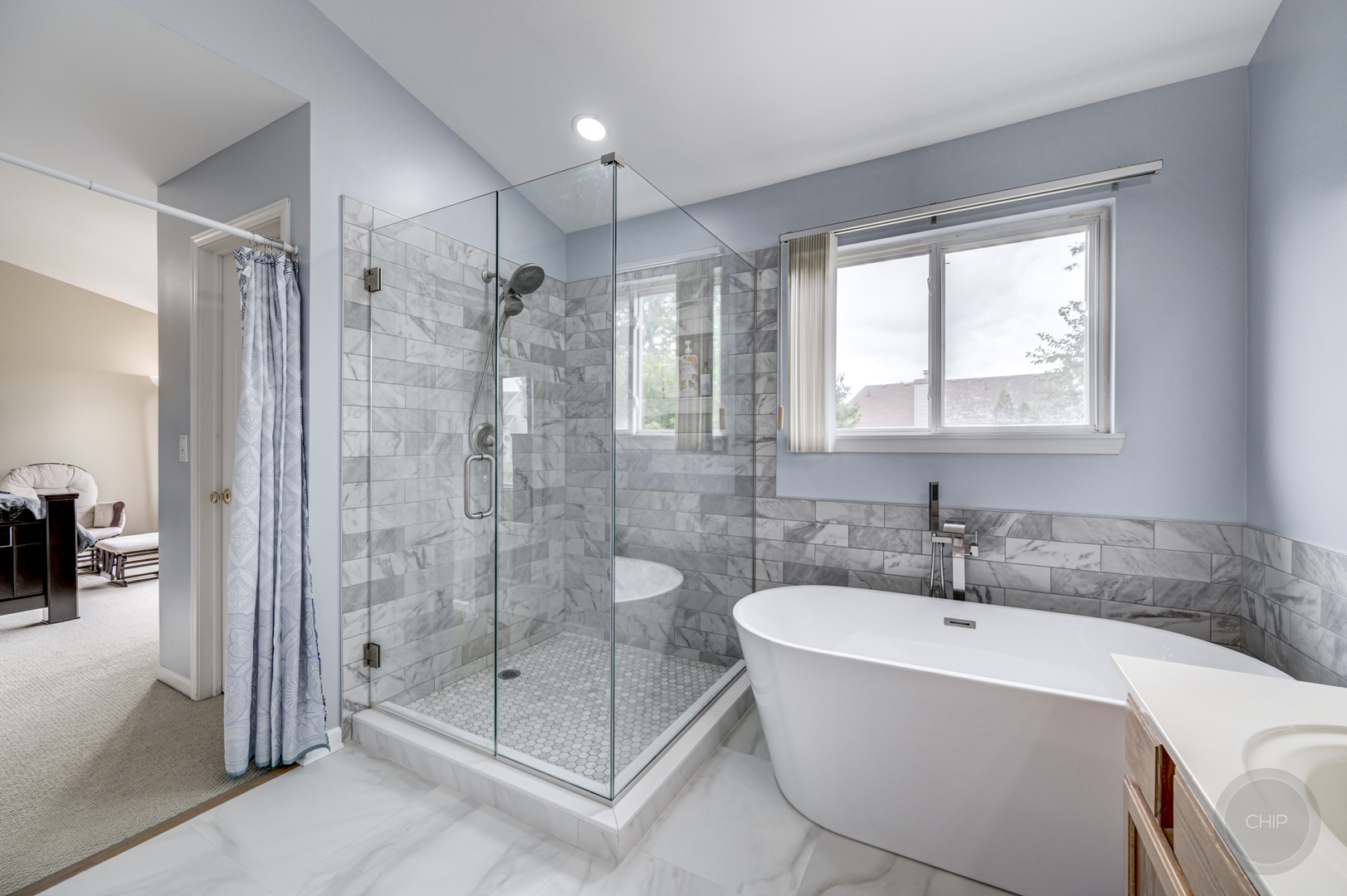 2135 Skylane Drive Naperville, IL 60564 - Photo 25 of 44 a bathroom with a bathtub and a shower