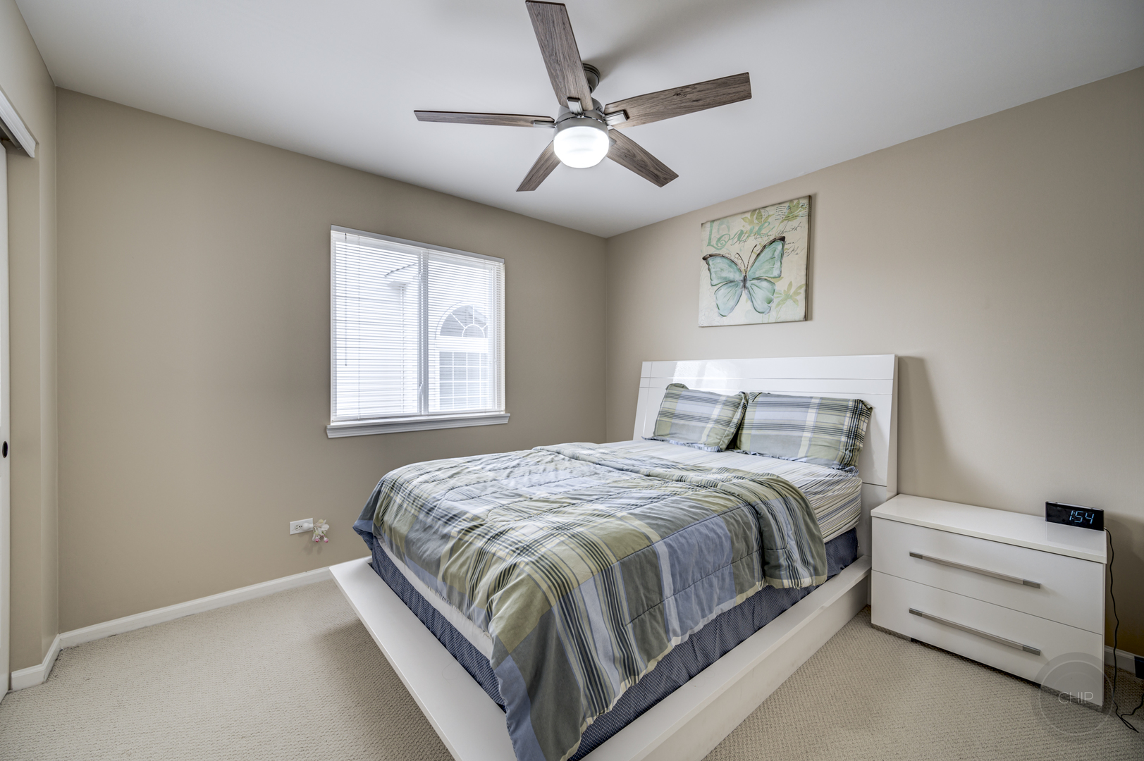 2135 Skylane Drive Naperville, IL 60564 - Photo 26 of 44 a bedroom with a bed and a window