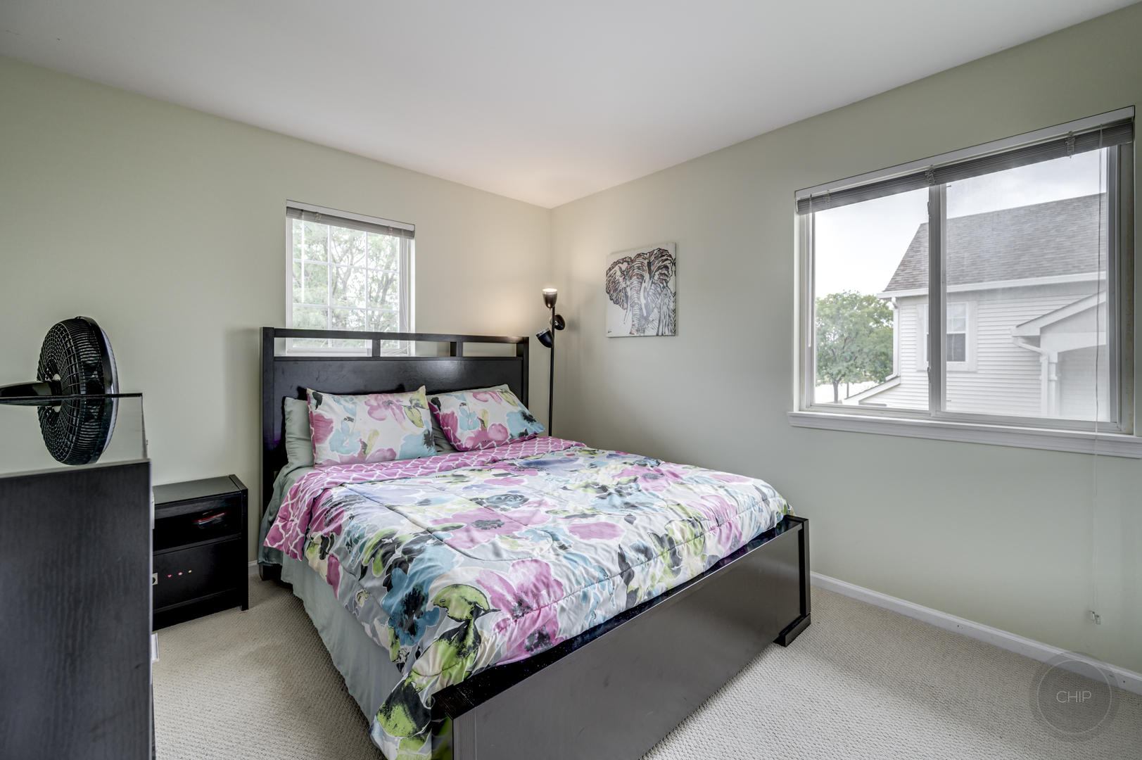 2135 Skylane Drive Naperville, IL 60564 - Photo 27 of 44 a bedroom with a bed and window