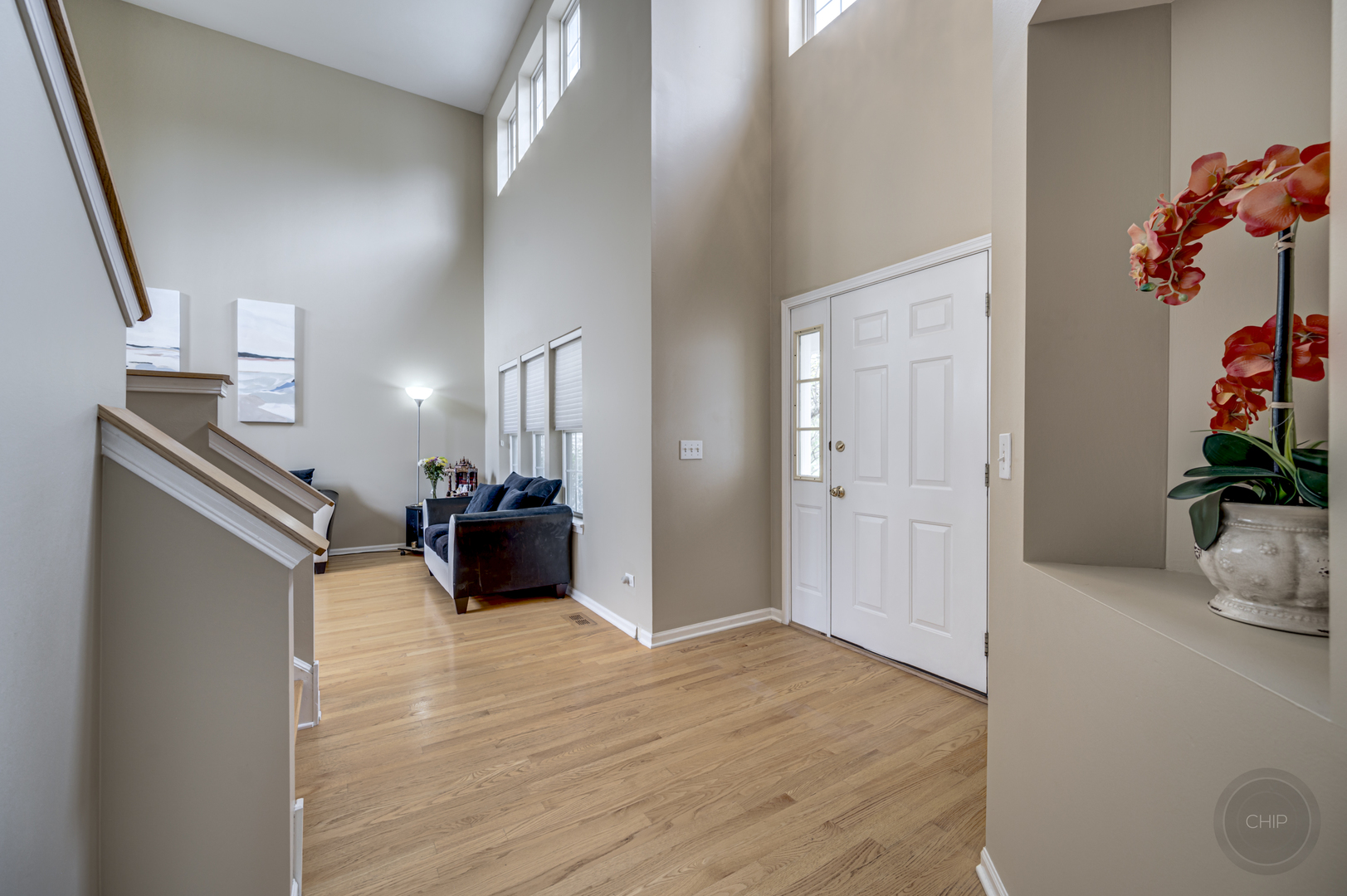 2135 Skylane Drive Naperville, IL 60564 - Photo 3 of 44 a view of a livingroom with furniture and a flat screen tv