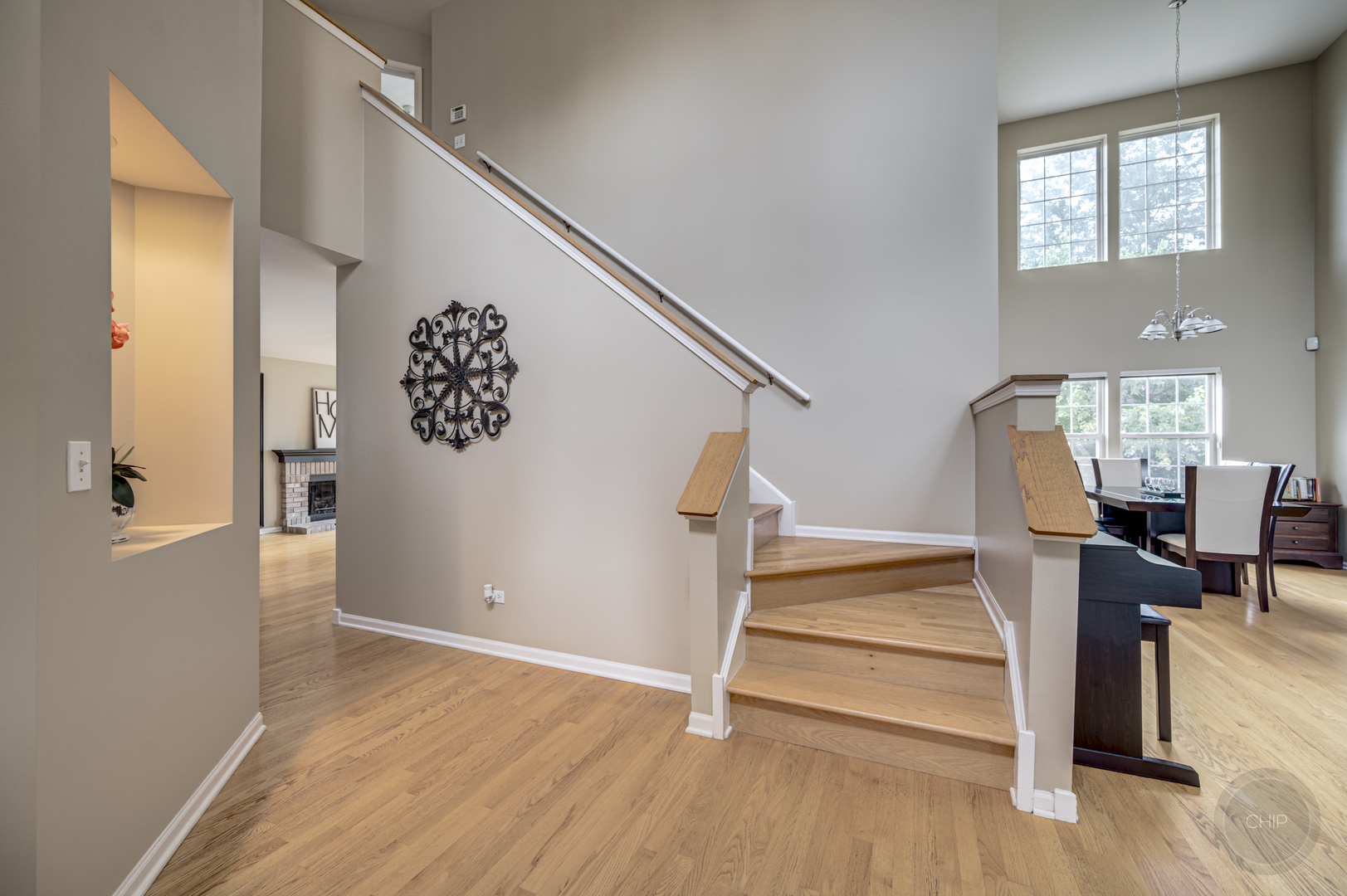 2135 Skylane Drive Naperville, IL 60564 - Photo 4 of 44 a view of entryway with wooden floor and stairs