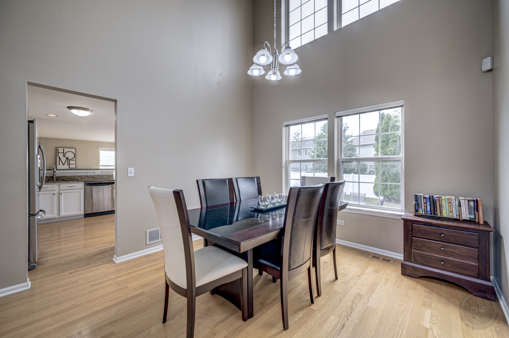 2135 Skylane Drive Naperville, IL 60564 - Photo 10 of 44 a dining room with furniture and wooden floor