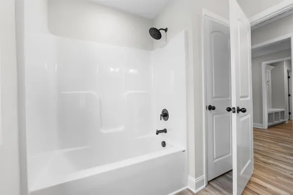 a bathroom with a granite countertop sink a toilet and a mirror