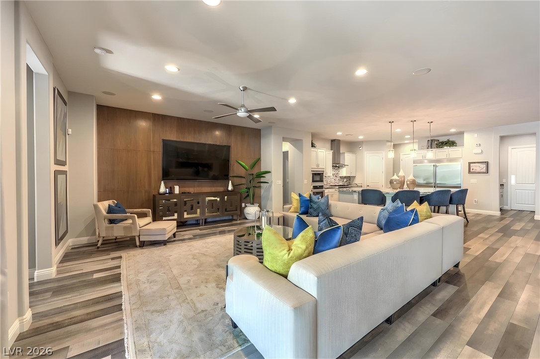 7119 Arabian Ridge Street Las Vegas, NV 89131 - Photo 20 of 73 An open concept living area seamlessly connects to a gourmet kitchen, perfect for entertaining.