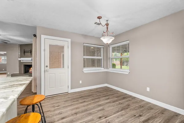 a view of livingroom and kitchen with wooden floor